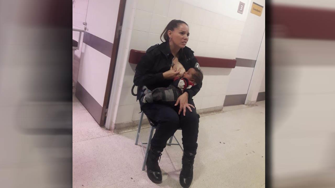 Argentina Policewoman Breastfeeding A Crying Baby While On Duty