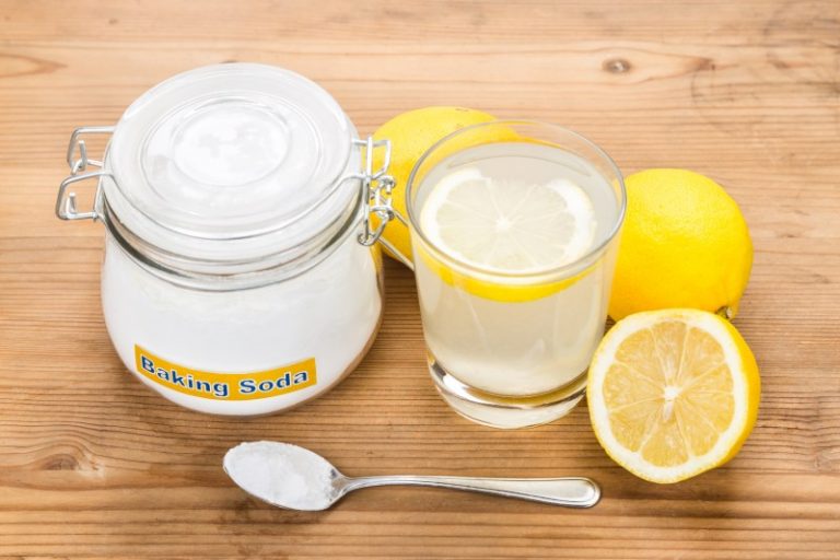 Baking soda with lemon juice in glass for multiple holistic usages