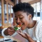 a black woman eating