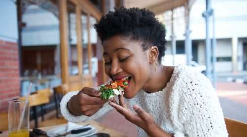a black woman eating